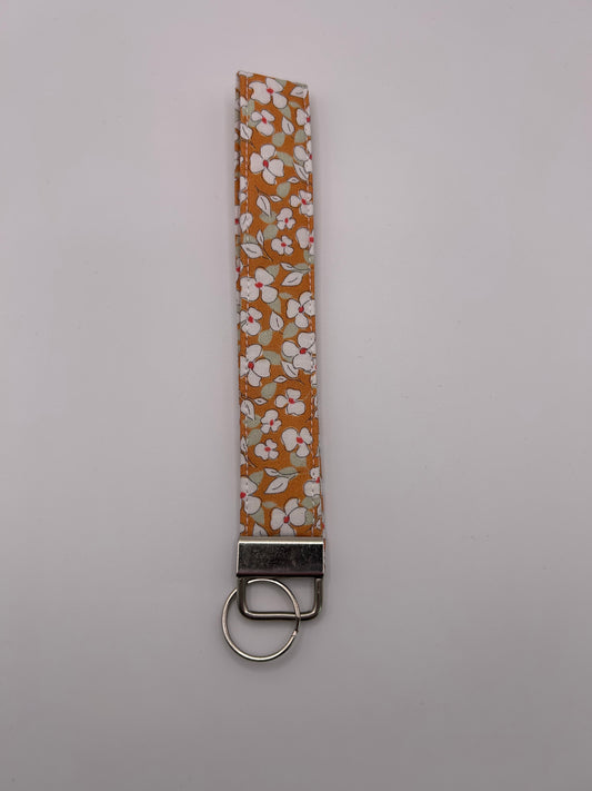 Orange and White Flower Wristlet