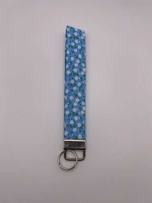 Blue Ditsy White Flowers Wristlet